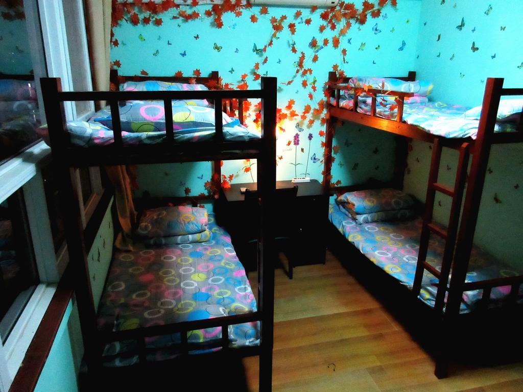 25°C Four Season Youth Hostel Qingdao Quarto foto