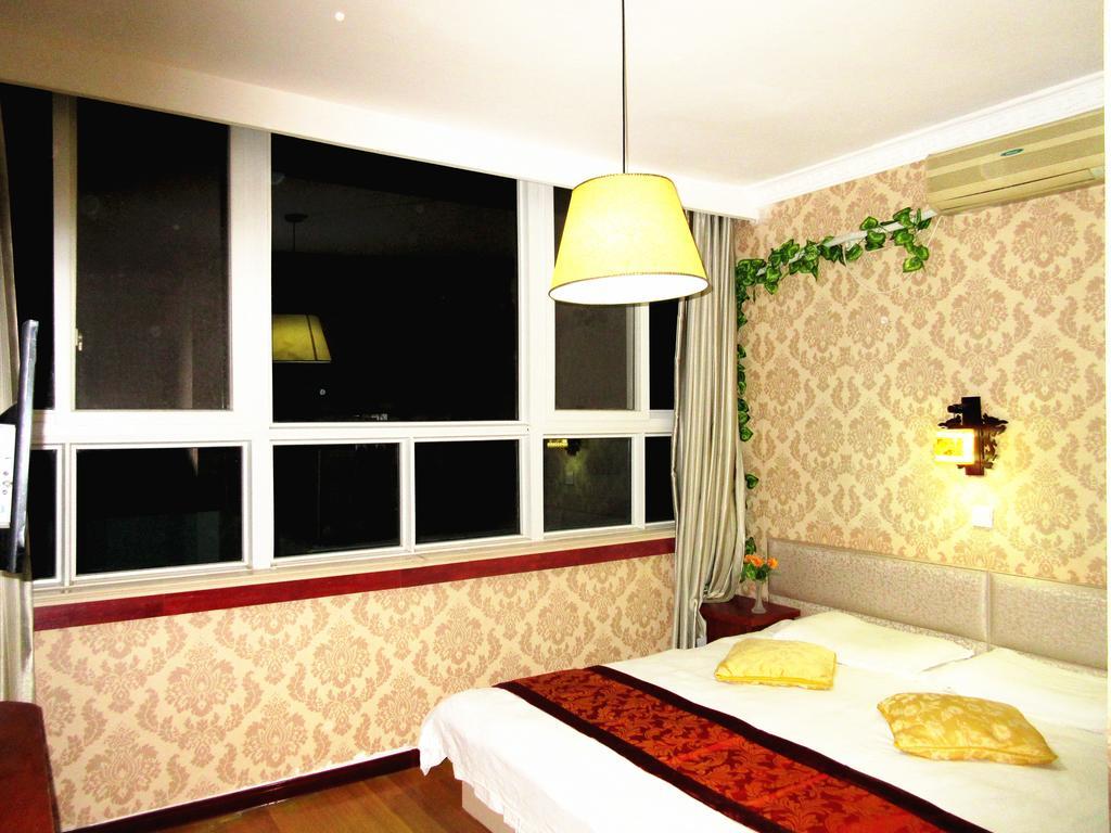 25°C Four Season Youth Hostel Qingdao Quarto foto